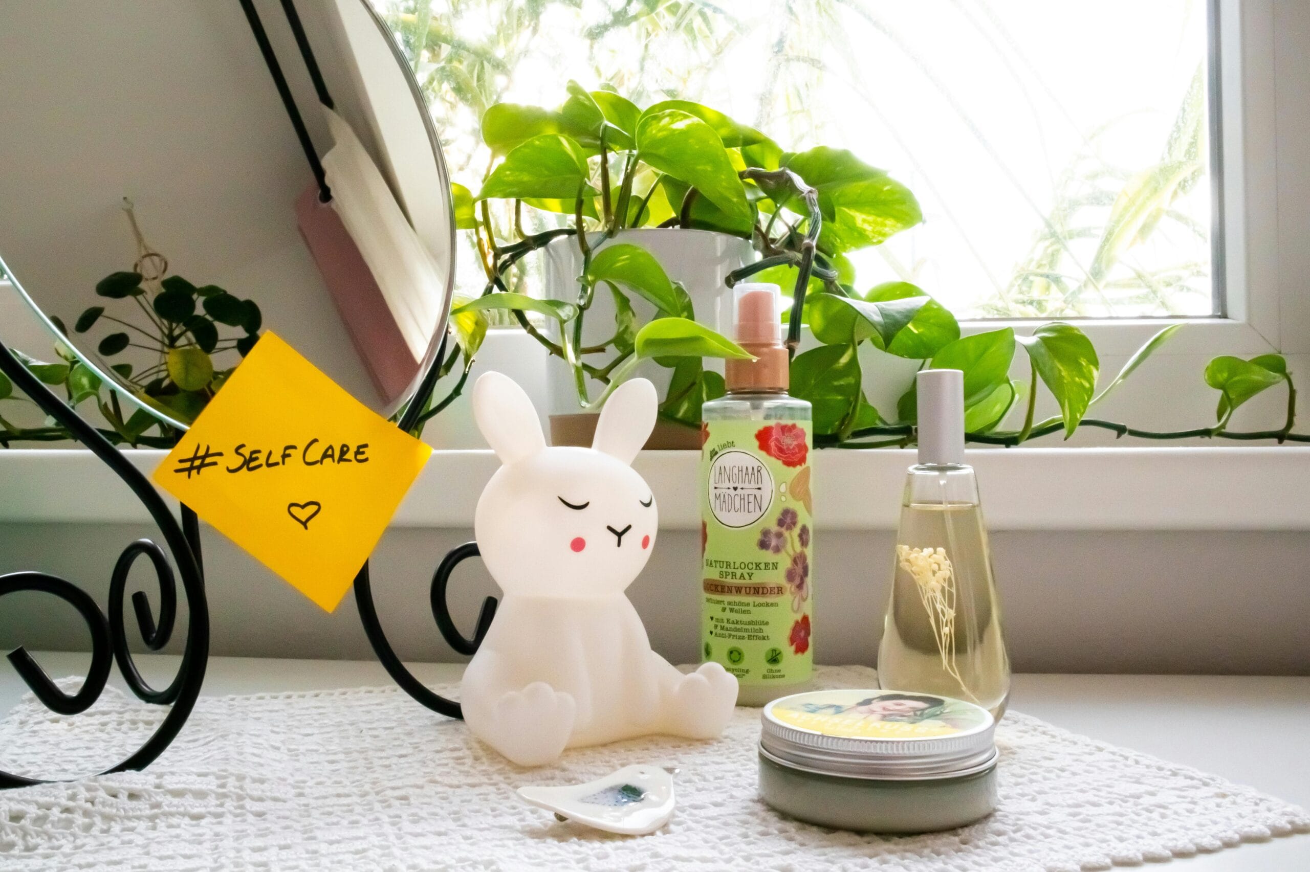 How to Build a Simple Self-Care Routine That Actually Reduces Anxiety A soothing self-care corner with a bunny lamp, cosmetics, and a mirror, perfect for a relaxing routine.